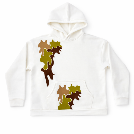 White hoodie with brown and green camouflage pattern on a white background. ivory camouflage oversized hoodie heavyweight cotton streetwear