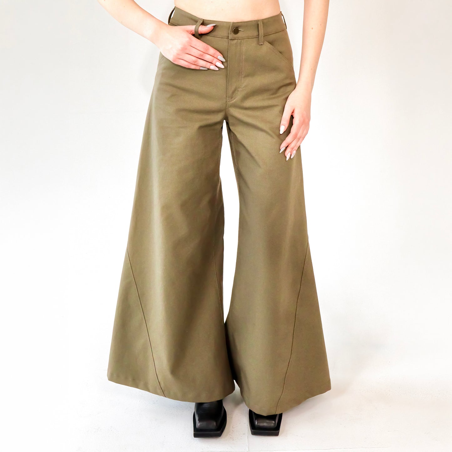 person wearing Khaki wide leg cotton trousers, extra long for tall people on a white background