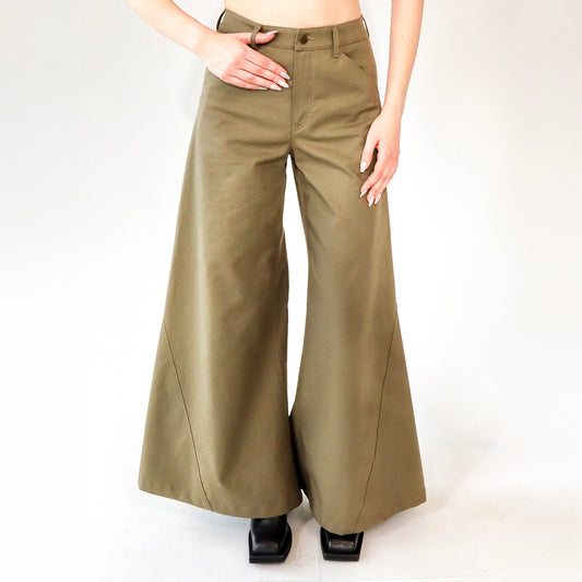 person wearing Khaki wide leg cotton trousers, extra long for tall people on a white background