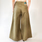 person wearing Khaki wide leg cotton trousers, extra long for tall people on a white background