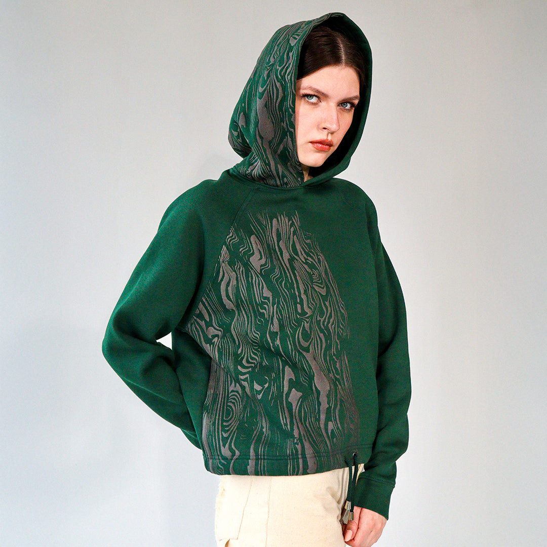 person wearing a Cropped bark pattern black hoodie with drawstring waist
