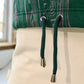 close up of cropped green hoodie with drawstring waist