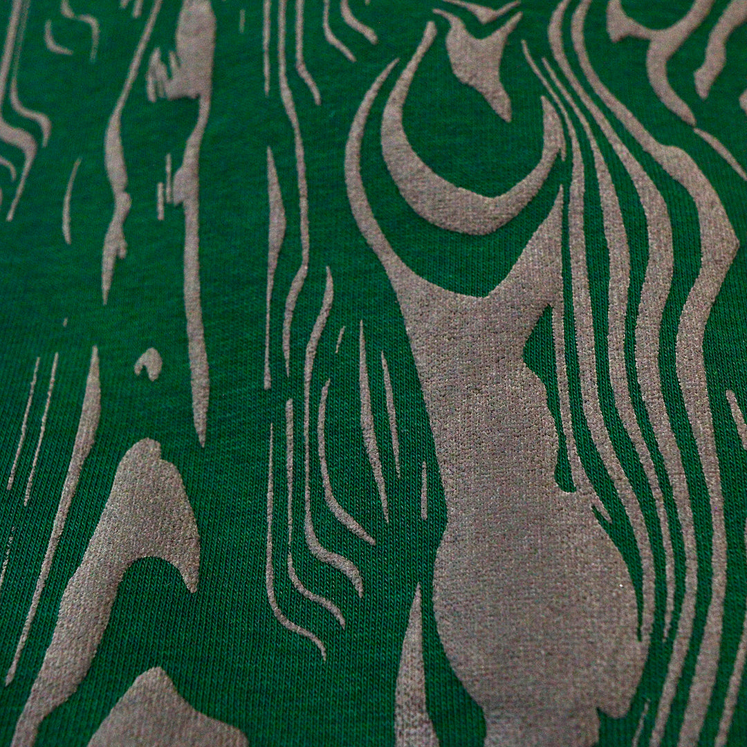 close up of bark print on green hoodie